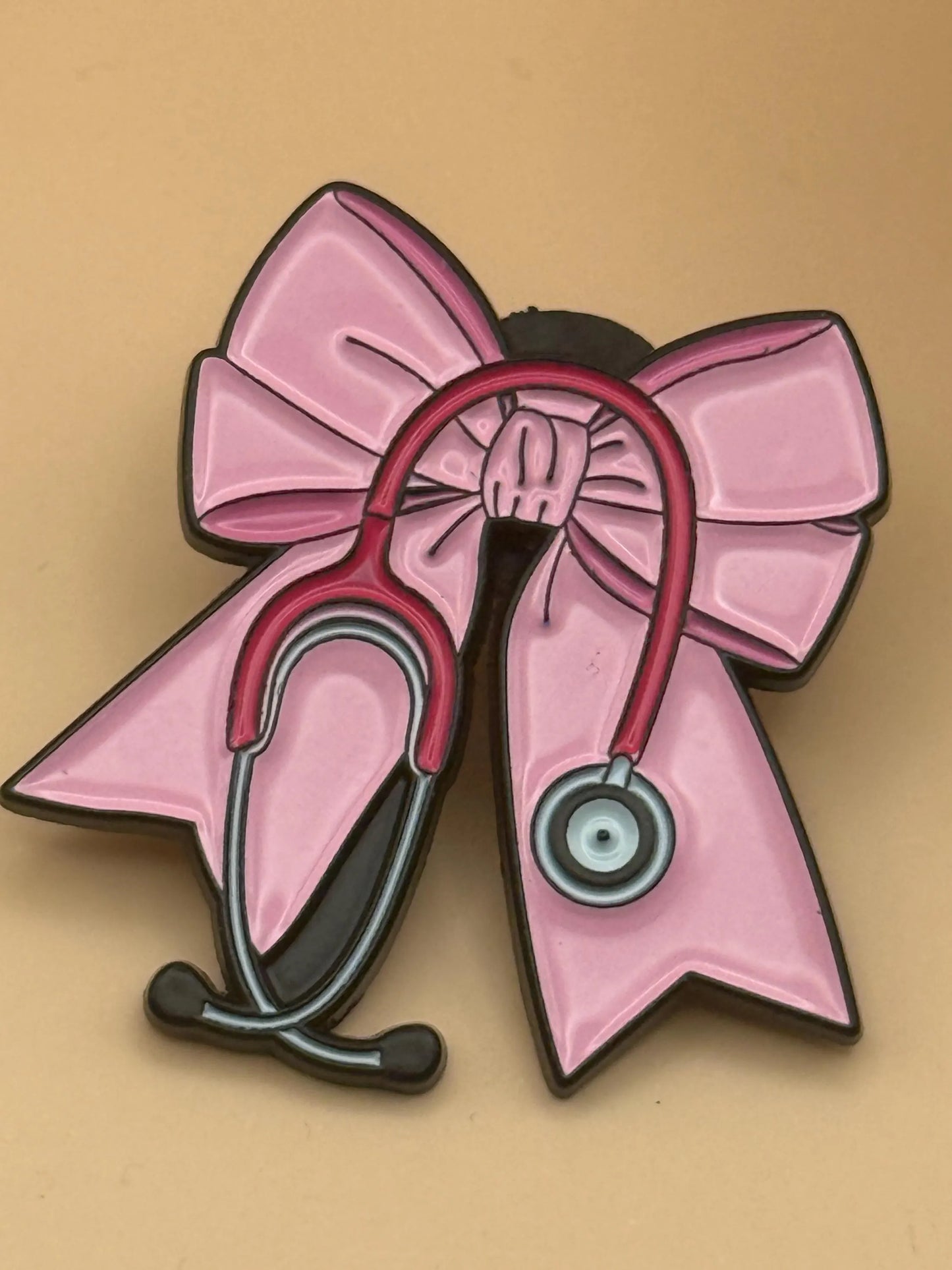 Bow and Stethoscope Enamel Pin